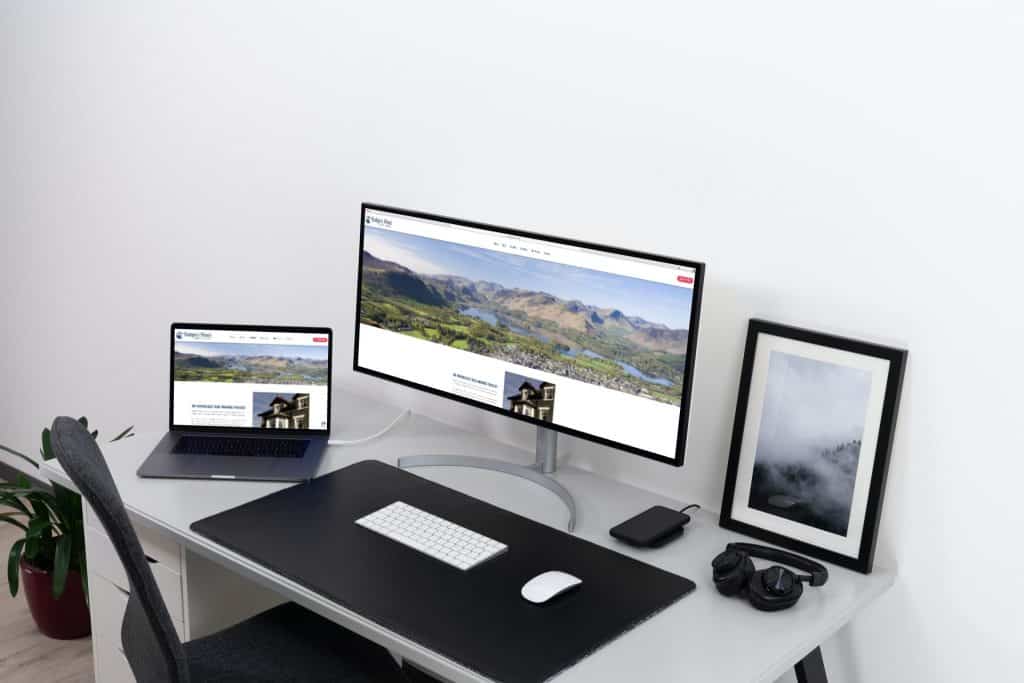 mockup of badgers wood site on laptop and desktop