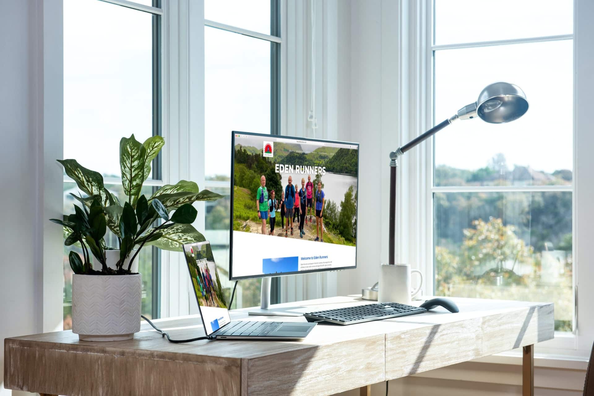 mockup of eden runners site on laptop and desktop