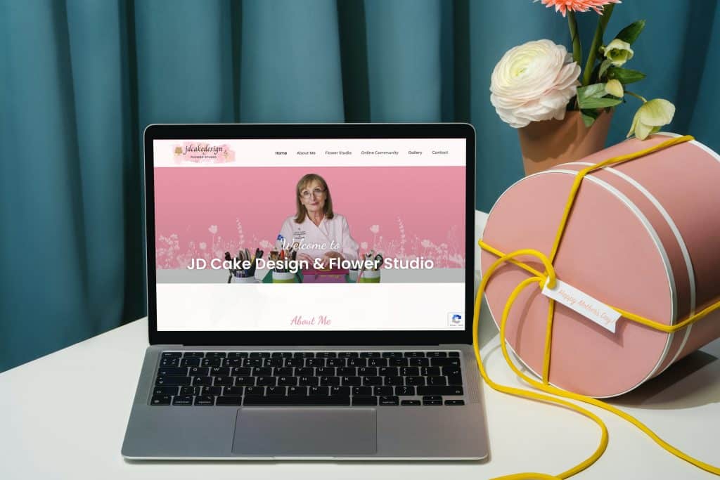 Mockup of JDCake design on laptop